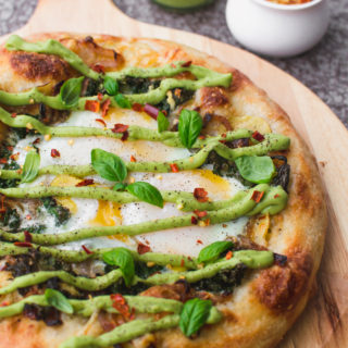 vegetarian brunch pizza with baked eggs